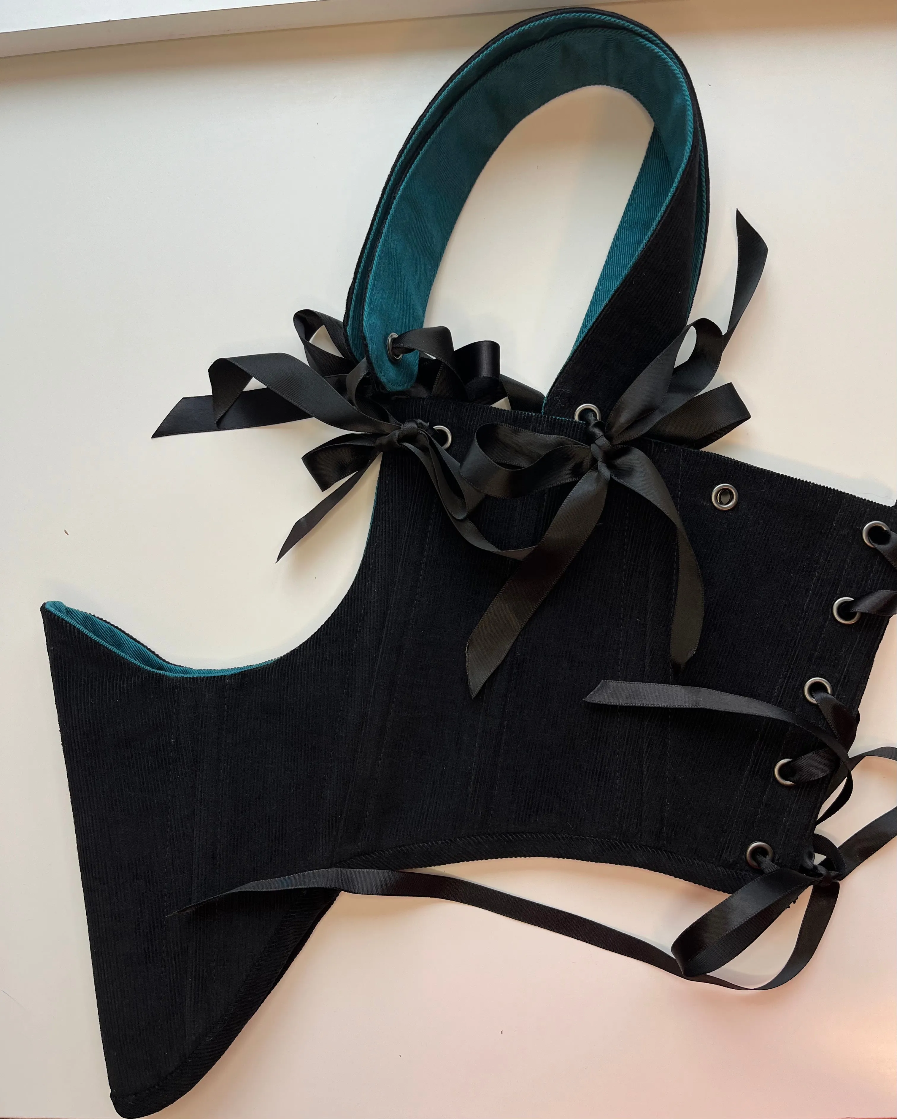 M-L reversible underbust corsage in black corduroy/teal denim with ribbon bows