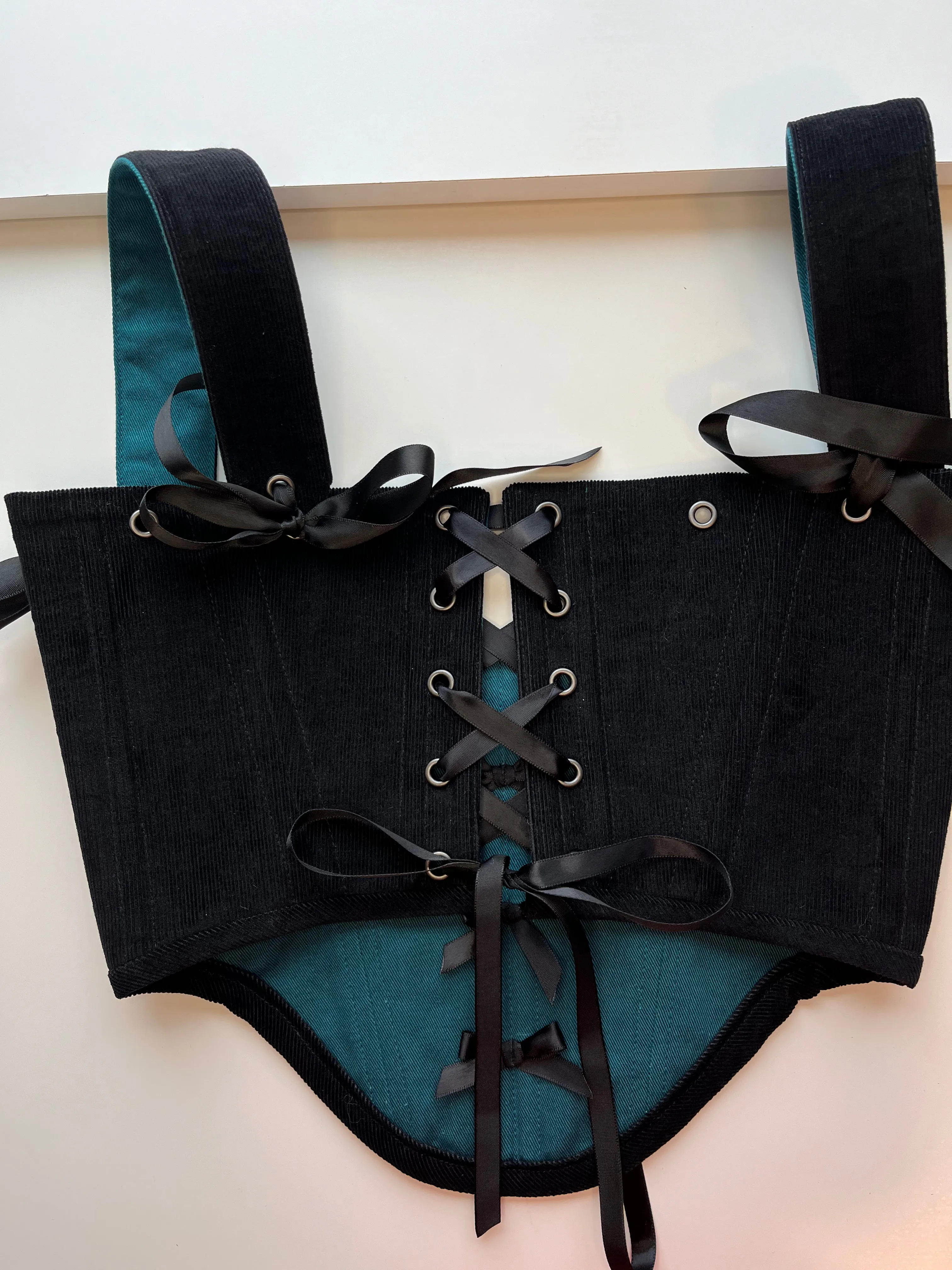 M-L reversible underbust corsage in black corduroy/teal denim with ribbon bows