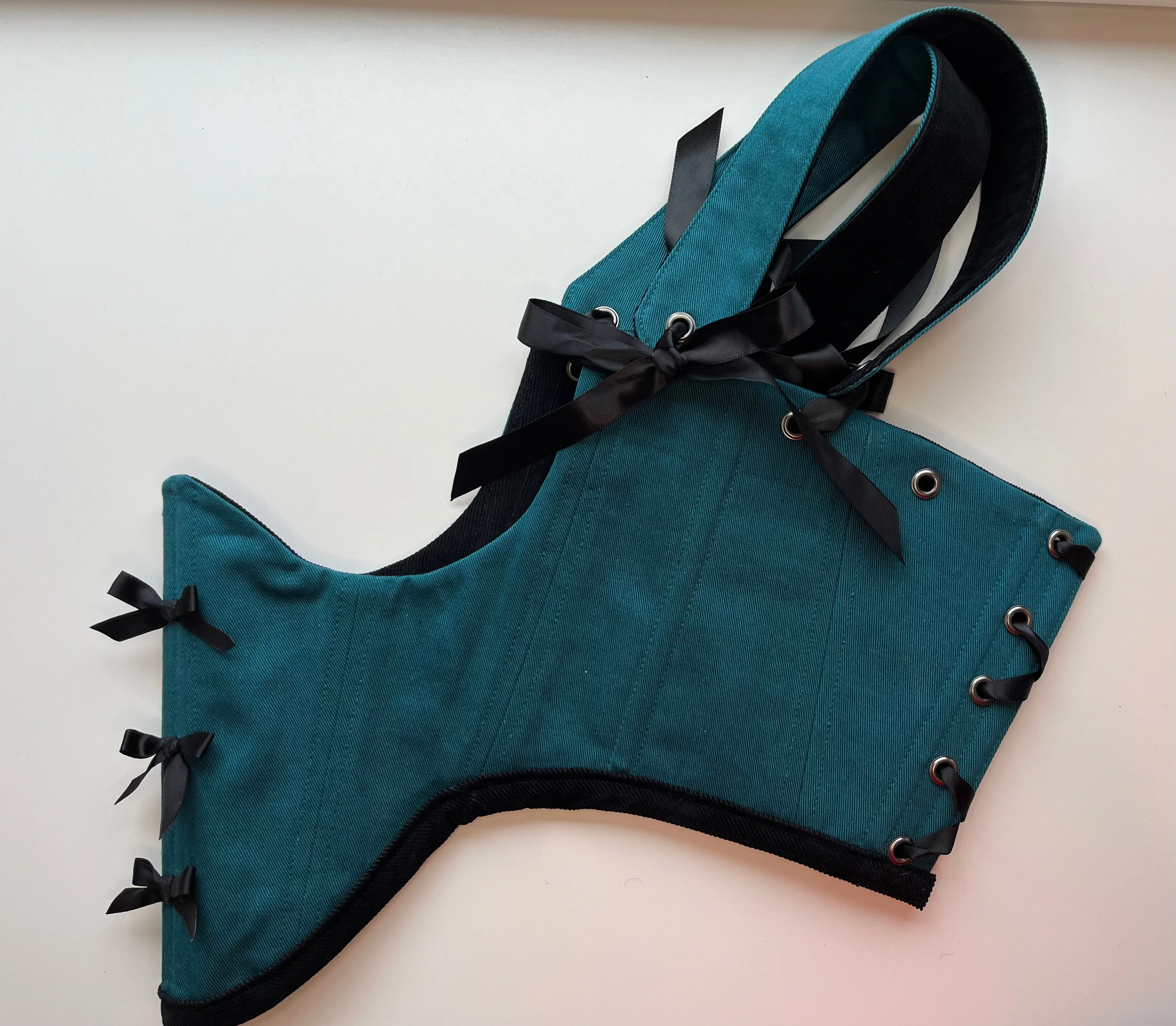 M-L reversible underbust corsage in black corduroy/teal denim with ribbon bows