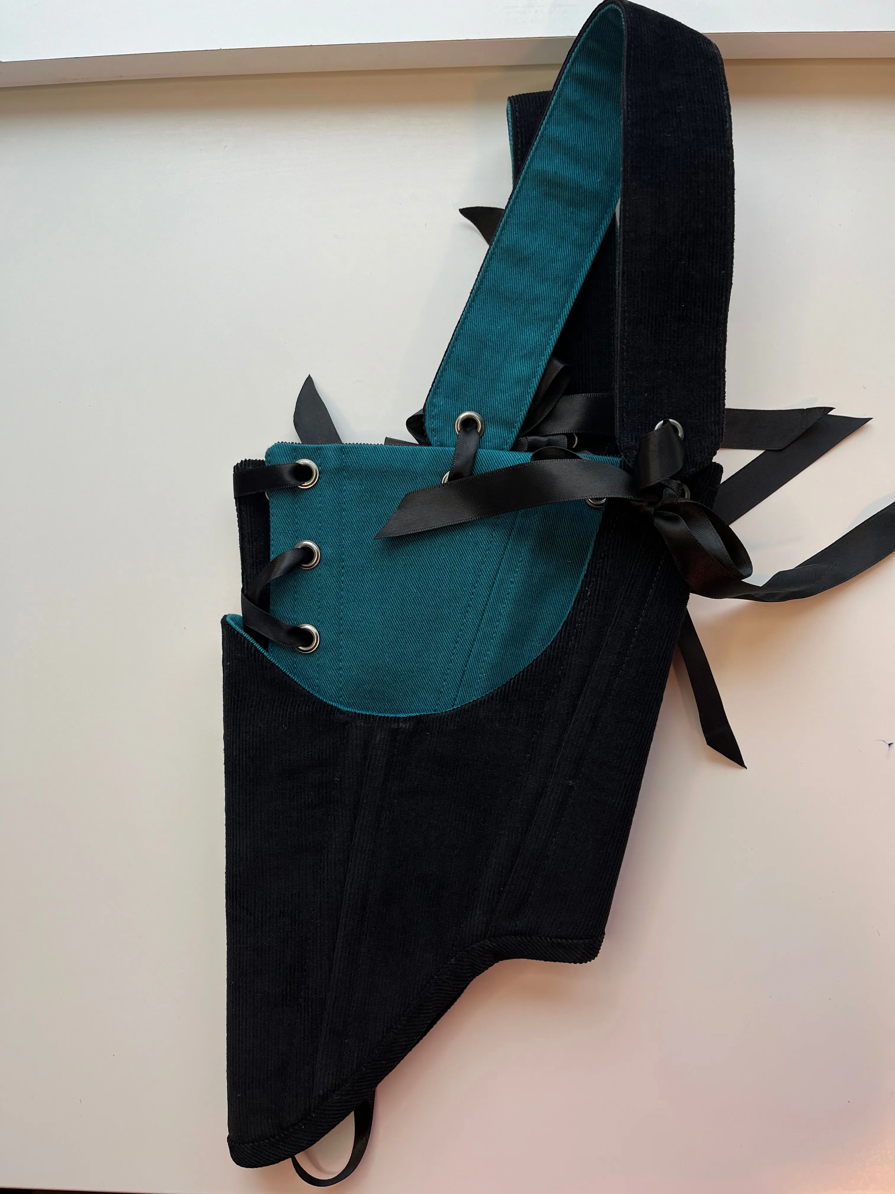 M-L reversible underbust corsage in black corduroy/teal denim with ribbon bows